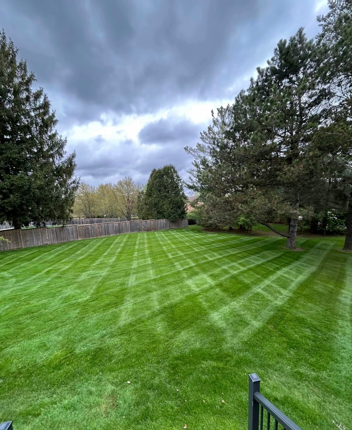 Diamond-pattern lawn with dramatic stormy sky