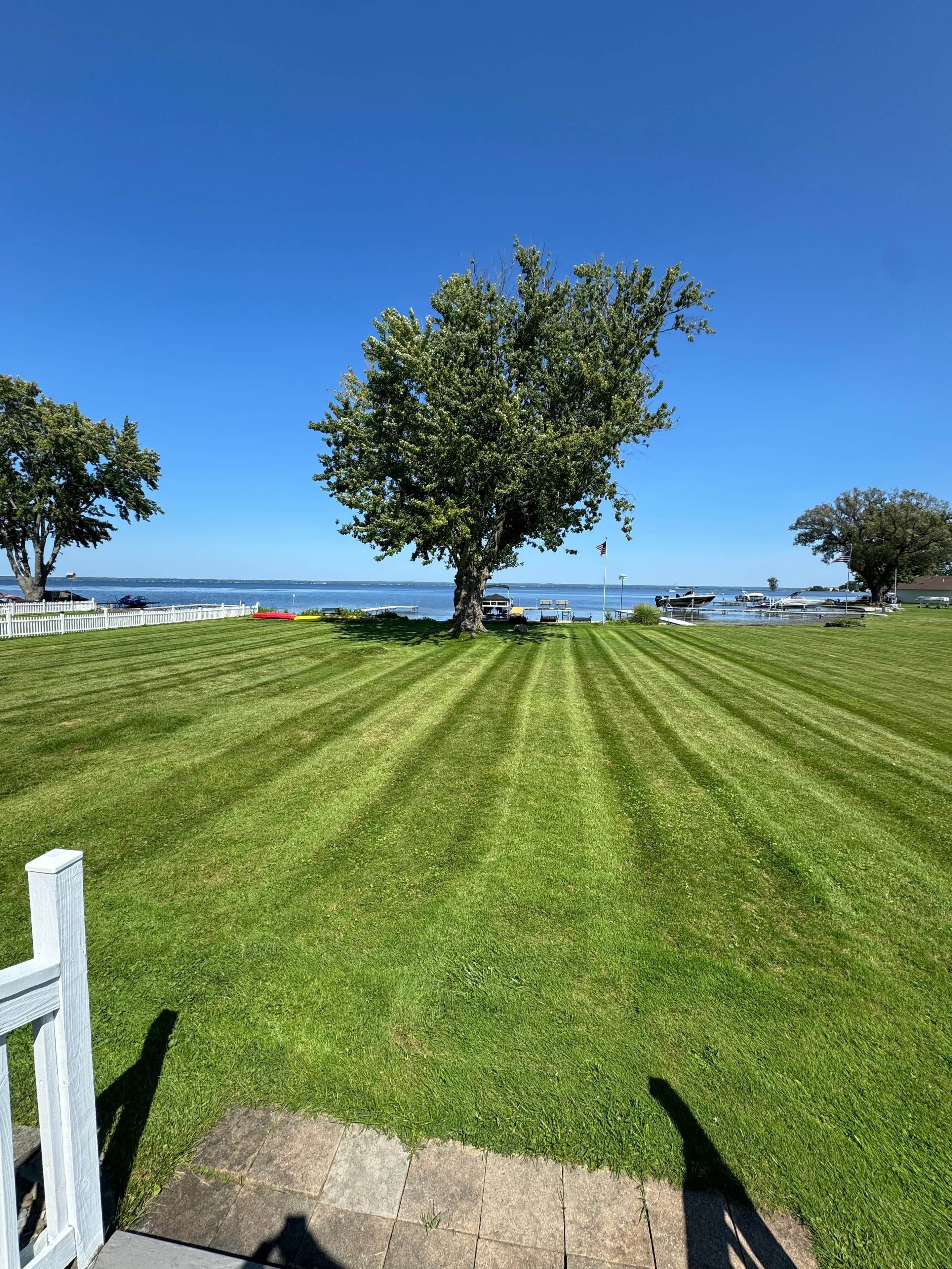Lakefront property with perfectly striped lawn